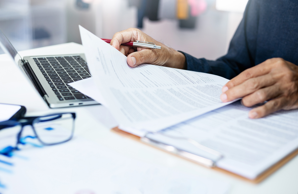 property manager sorting through paperwork